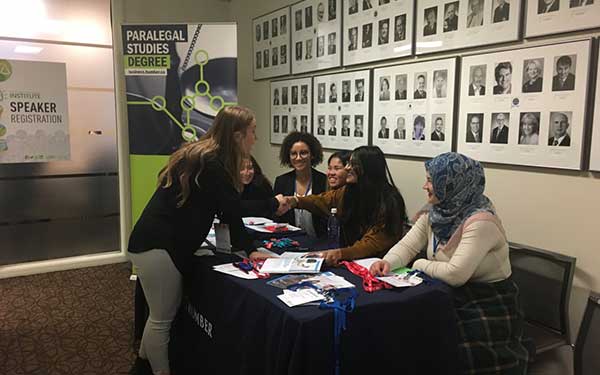 Paralegal students staffing OBE table