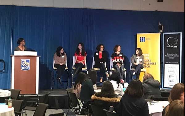 Panel addressing audience of professionals