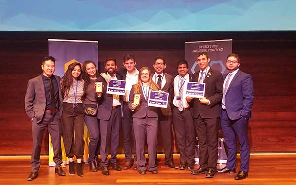 Winning students pose with awards