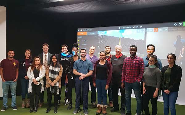 Students posing in golf lab