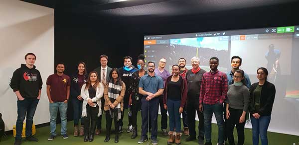 Students posing in golf lab