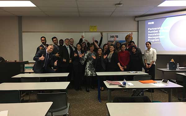 Students posing for picture in classroom