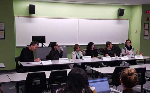 PAC members talking to business students