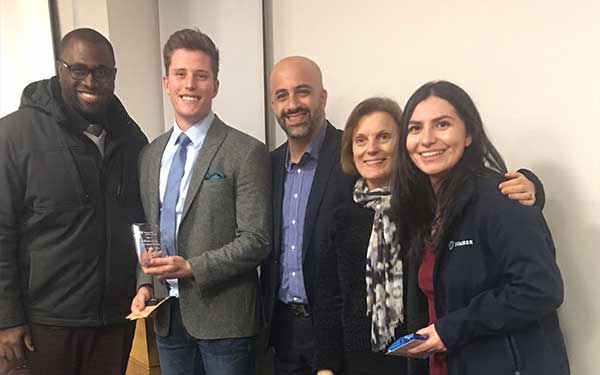 Marketing student winners with dean
