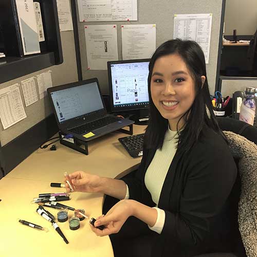 Nicole Seow at her desk