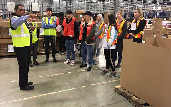 Fashion students in a warehouse