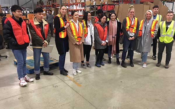 Fashion students in a warehouse