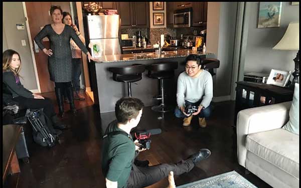Students shooting footage in apartment 