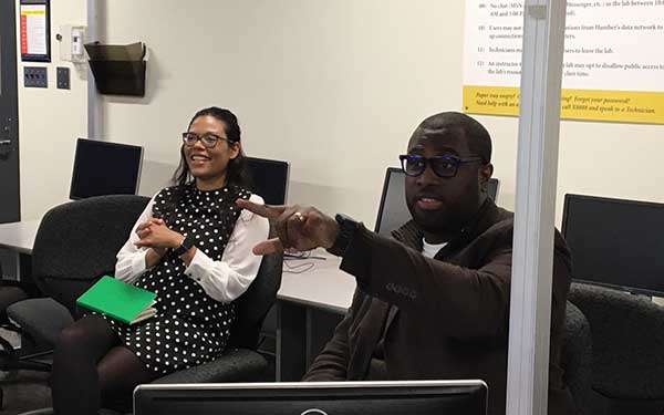 Man and woman sitting in classroom