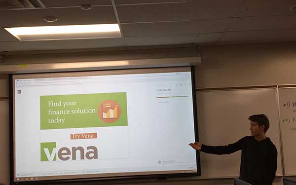 Student presenting design on screen
